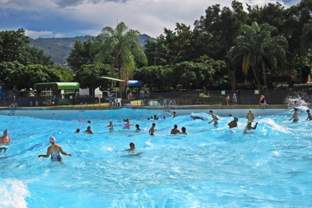 People swimming in the wave pool at Aeroparque Juan Pablo II