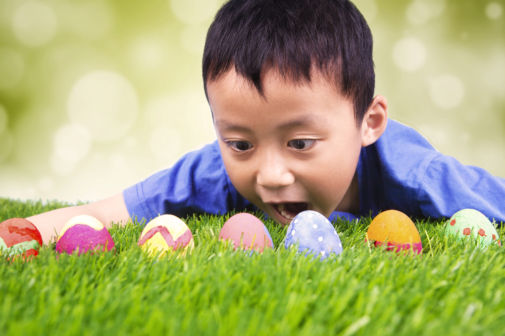 Boy looking in amazement at Easter eggs
